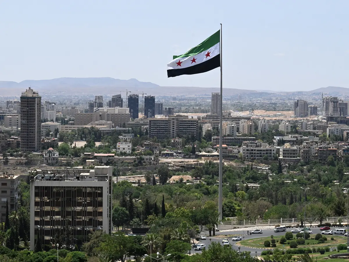Damascus cityscape with Mount Qasioun in the background